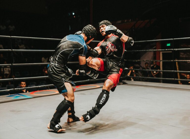 Exciting mixed martial arts fight captures powerful kick in action inside the ring.